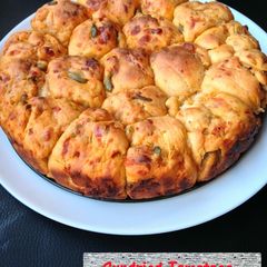 Sundried Tomatoes, Olive, Cheese Bread A picture of Sundried Tomatoes, Olive, Cheese Bread.