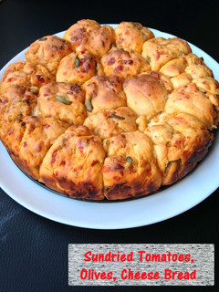 A picture of Sundried Tomatoes, Olive, Cheese Bread.