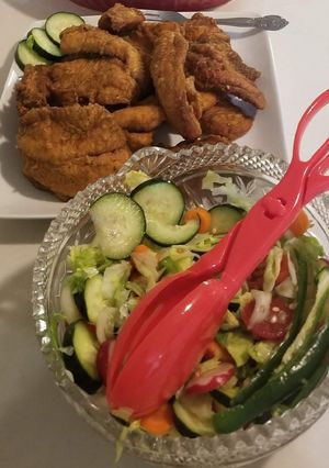 A picture of Crispy Fried Fish with mix Salad.