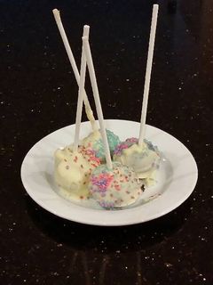 A picture of Chocolate Fudge Cake Pops With White Choclate Coating.