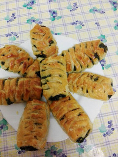 Una foto de Trenzas de hojaldre rellenas de espinacas y salmón