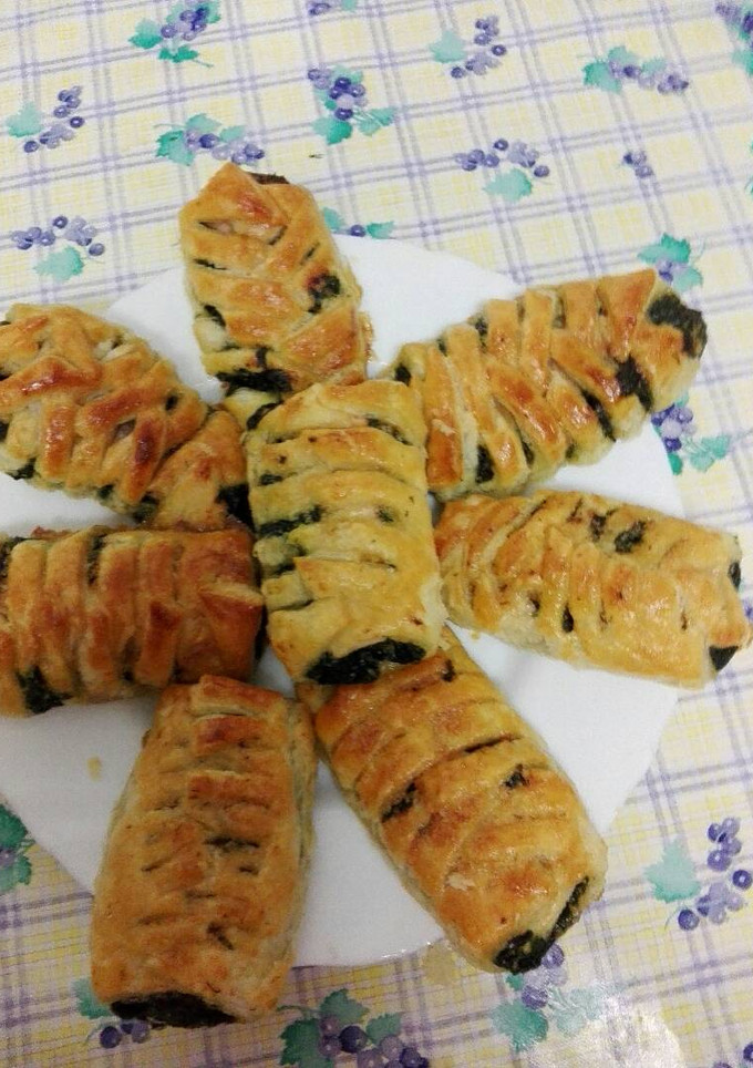 Una foto de Trenzas de hojaldre rellenas de espinacas y salmón