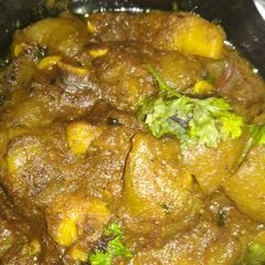 A picture of Potatoes and pointed gourd curry.