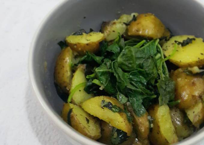 Sautéed baby potatoes with steamed spinach