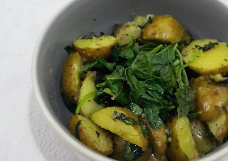 Sautéed baby potatoes with steamed spinach