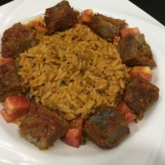 A picture of Jollof rice with beef.