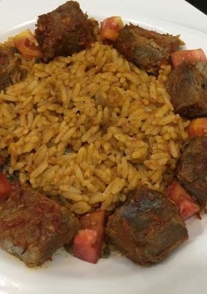 A picture of Jollof rice with beef.
