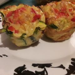 A picture of Egg muffins wrapped in Zucchini.