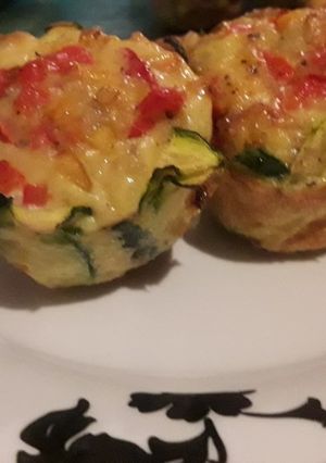 A picture of Egg muffins wrapped in Zucchini.