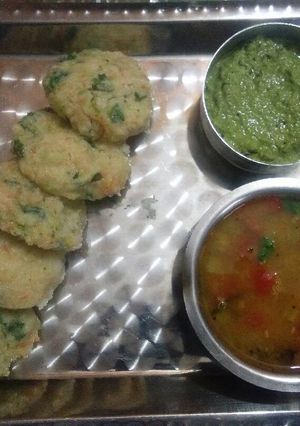A picture of Vegetable idli,sambhar or coconut ki chutney.