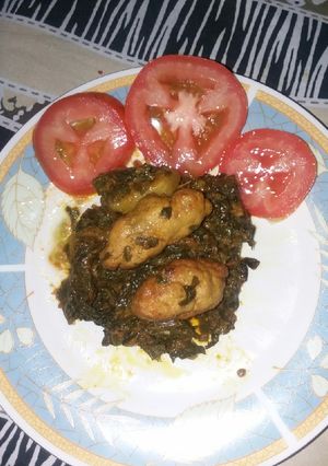 A picture of Kafta kabab with spinach.