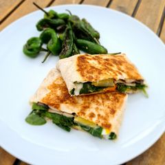 A picture of Healthy egg and veggie toasted wrap with cream cheese.