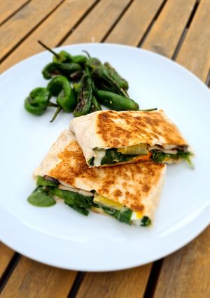 A picture of Healthy egg and veggie toasted wrap with cream cheese.