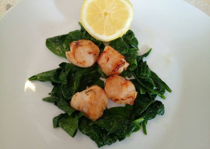 Pan fried scallops with wilted spinach