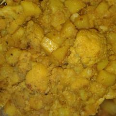 A picture of Potatoes and cauliflower stir fry.