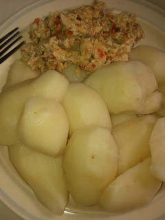 A picture of Boiled Irish potatoes and fried egg.