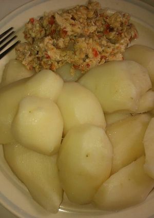 A picture of Boiled Irish potatoes and fried egg.