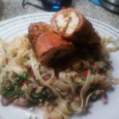 A picture of Cajun Chicken wrapped with bacon on Chimichurri Tagliatelle.