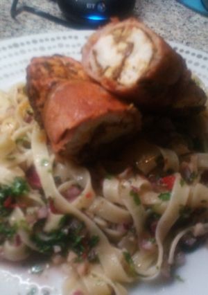 A picture of Cajun Chicken wrapped with bacon on Chimichurri Tagliatelle.
