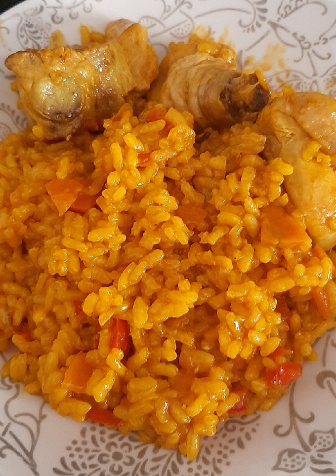 Una foto de Arroz meloso de pollo y costillas