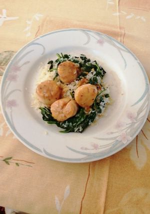 Una foto de Callos de hacha a la naranja