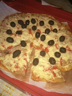 Una foto de Pizza de masa italiana