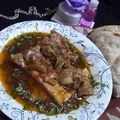 A picture of Beef Paye and roti.