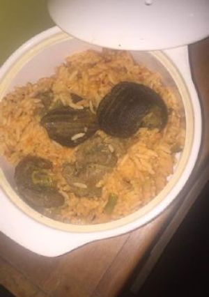 A picture of Jollof rice with goat meat.