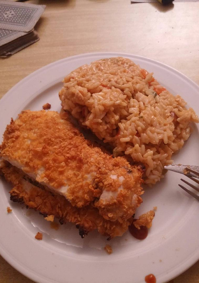Una foto de Pollo con cereales y arroz