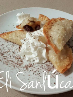 Foto principal de Empanadillas dulces de manzana y pasas