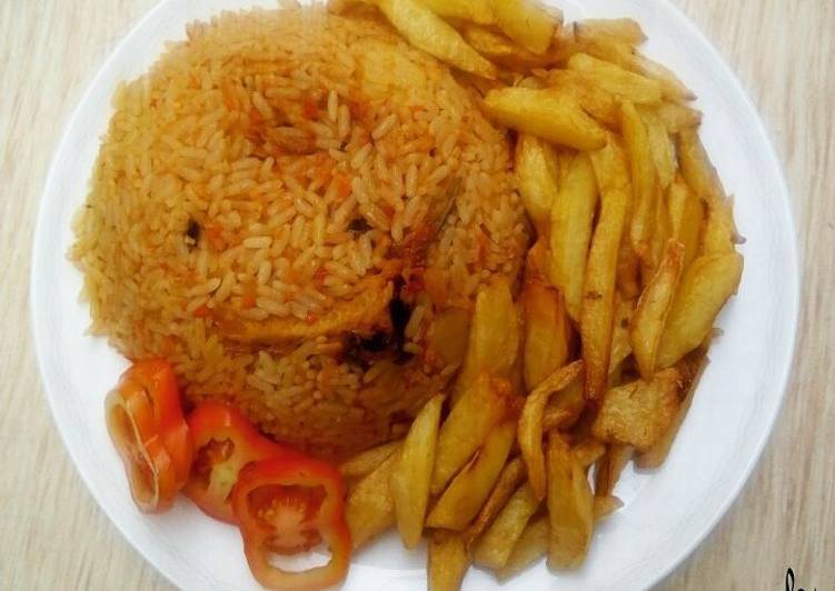 Read This To Change How You Jollofrice,with fried Irish potatoes and tomatoes