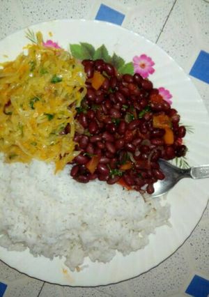 A picture of Boiled Rice with bean stew and fried cabbage.