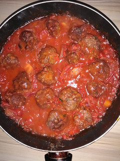 A picture of Meatballs in tomato sauce.