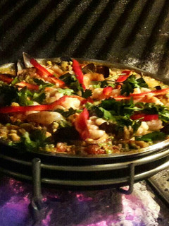 Una foto de Paella al disco