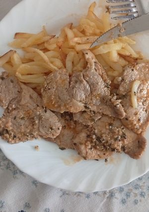Una foto de Lomo ajillo adobado