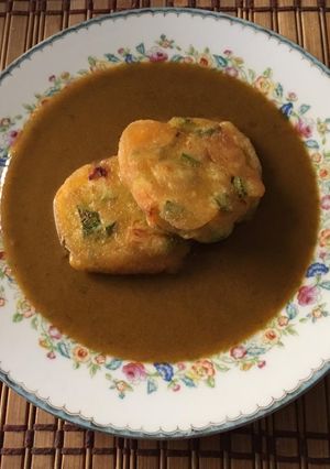 Una foto de Tortitas de calabacitas con mole de masa