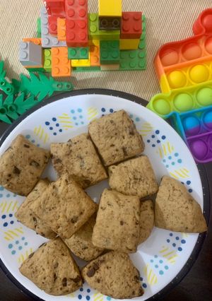 A picture of Square milk choco cookies in a cookie dough batter.