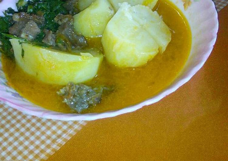 Stewed potatoes with meat and kales