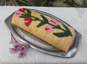 Una foto de pionono relleno de crema