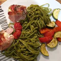A picture of Baked garlic chicken with roasted veg and linguine.