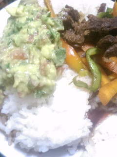 A picture of Rice and beef stew with guacamole.