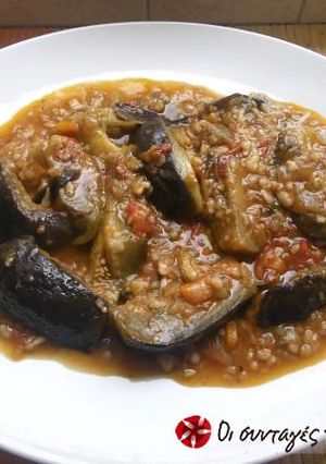 A picture of Eggplants with xynohondro (sour chunk) trahana.