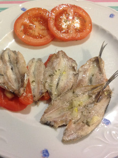 Una foto de Boquerones al horno con pimientos morrón