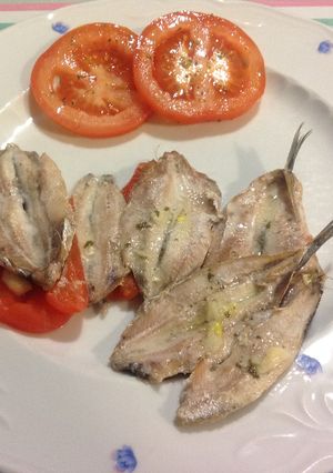 Una foto de Boquerones al horno con pimientos morrón