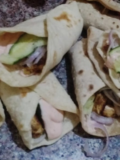A picture of Chicken roll with tortilla.