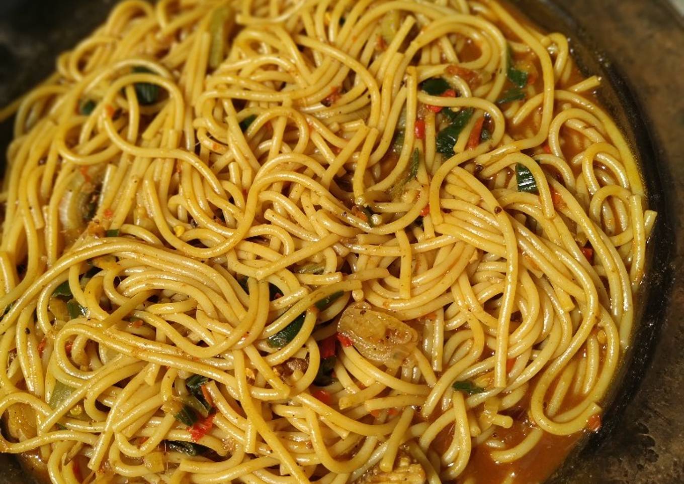 Local spaghetti jollof with Locust beans