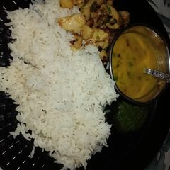 A picture of Dal Rice, Fried Potatoes and Chutney.
