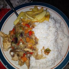 A picture of Rice+fried potato& veggies sauce with scramble fish.