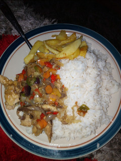 A picture of Rice+fried potato& veggies sauce with scramble fish.