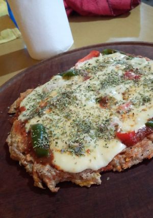 Una foto de Pizza a base de zanahoria y calabaza